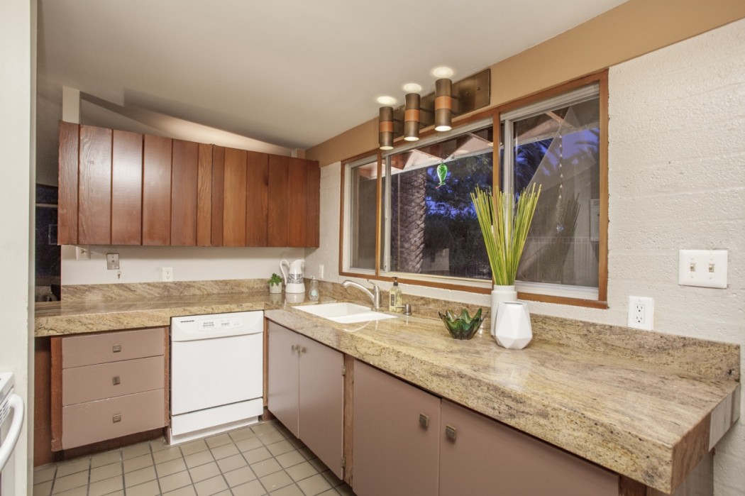 The original and intact cupboards are visible amongst the updates to this 1955 Al Beadle-designed property in Phoenix, AZ. Photo by Hi-Res Media.